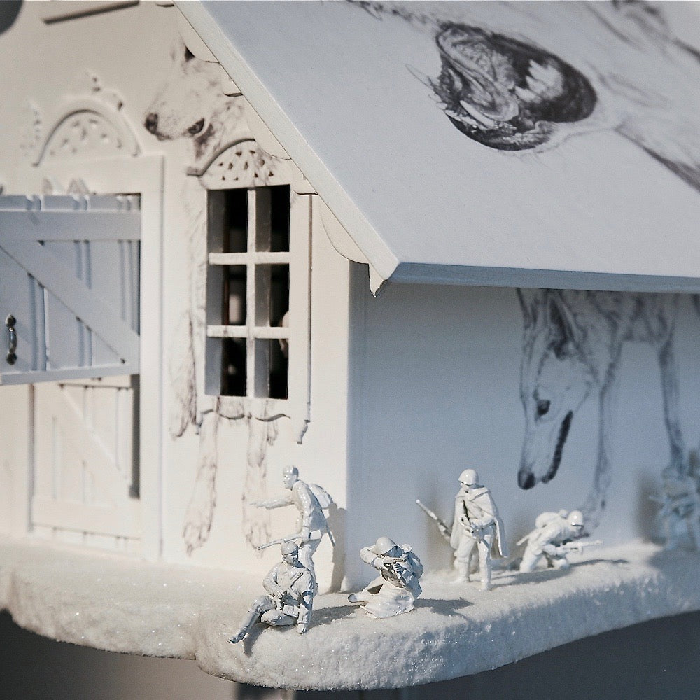 Detail of white wooden cuckoo clock - dolls house - wolf's house with Biro drawings of wolves and toy soldier figures